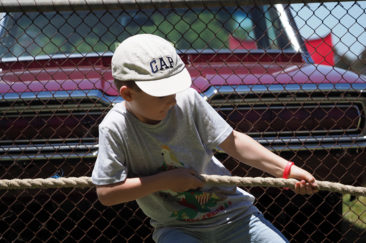 Little kid playing tug-a-war