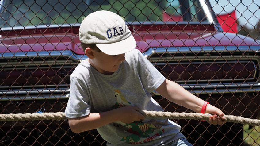 Little kid playing tug-a-war